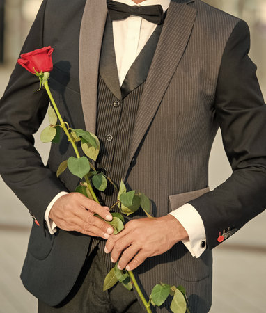 proposal concept. cropped view of black tuxedo man making a proposal. man before marriage proposalの写真素材