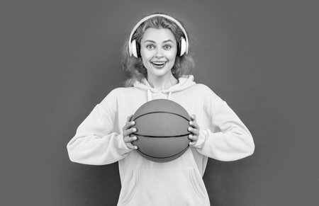 positive basketball woman player isolated on red background. basketball woman playerの写真素材