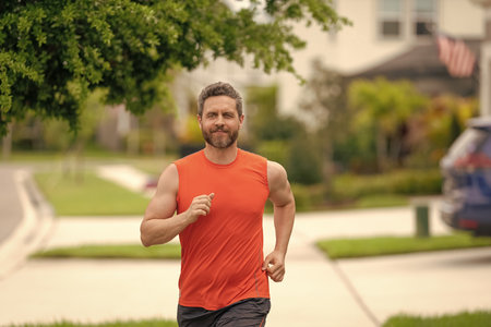 The running man feels sense of joy during the run. sport fit man jogging outdoor. running man races...