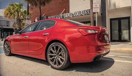Miami, Florida USA - March 25, 2023: red 2016 Maserati Ghibli S Q4 parcked car vehicel, back side viewのeditorial素材