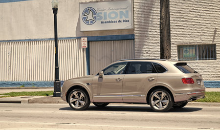 Miami Beach, Florida USA - April 15, 2021: silver Bentley Bentayga v8 2015 suv, back side view