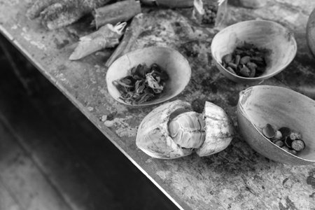 Dried beans and seeds, closeup. Spicy crops on wooden table. Organic cocoa and nutmeg beans.