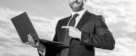 cropped view of business man freelancing on sky background. business man freelancingの写真素材