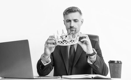 mature businessman in suit wear crown at the office.の写真素材