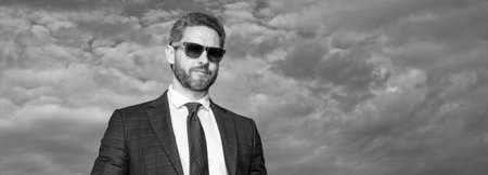 boss in suit on sky background, advertisement. boss in suit outdoor. boss in business suit. photo of...
