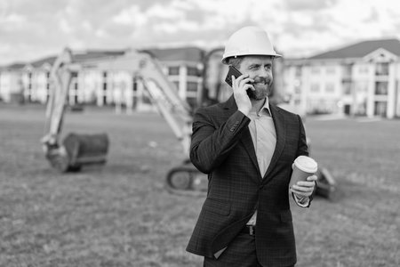 businessman construction investor with phone. businessman construction investor at coffee break....