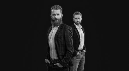 trendy men in formalwear on background. photo of men in formalwear suits. men in formalwear isolated on black. men in formalwear at studio.の写真素材