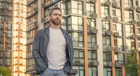 adult man in the street, advertisement. adult man outside. photo of adult man in white shirt. adult...