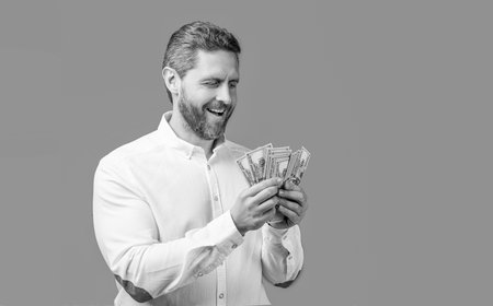 happy businessman hold money earning. photo of businessman holding earning money. businessman...