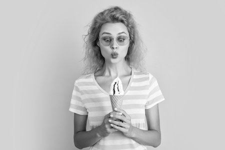 photo of girl with cone icecream at summer. girl with cone icecream isolated on yellow. girl with...
