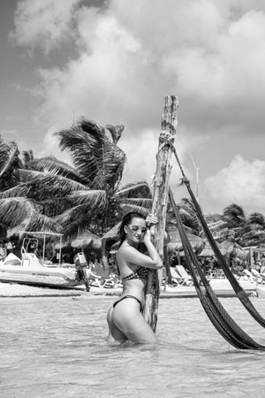 beautiful woman at beach on summer vacation holidays. photo of woman at beach on summer vacation. woman at beach on summer vacation. woman at beach on summer vacation outdoor.の写真素材