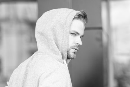 man in hoodie in the street. photo of man in hoodie. man in hoodie. man in hoodie outdoor.