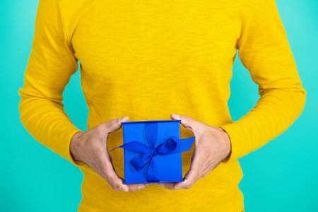 Present for mens day. Man on February 14. Man give present gift box for Valentines day. Happy...