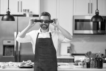 man cook lobster seafood in the kitchen, copy space. photo of man cook lobster seafood. man cook...