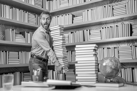 Teacher in school classroom. teacher with book in library classroom. teacher in college. Man with...