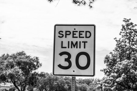 speed limit. road sign of 30 speed limit. caution white roadsign. traffic sign on the road. attention caution road sign.の写真素材