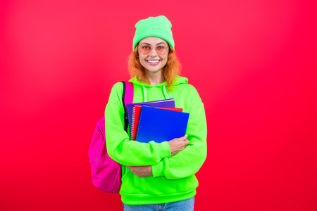 Woman student in university. Back to school. Knowledge day. Education in university. Woman isolated pink. September 1. Knowledge and education. School education. Students life. Educational curriculum.の写真素材