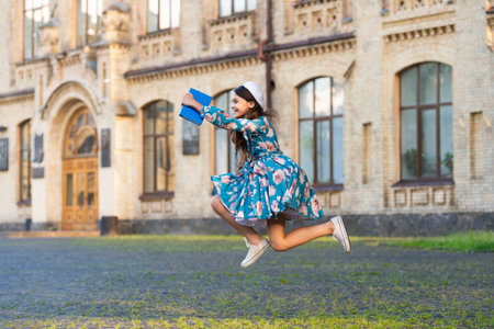 September 1. Time to study. Knowledge and education. School education. Students life. Teen girl jumping back to school. Knowledge day. Education in school. Girl student jump outdoor.の写真素材