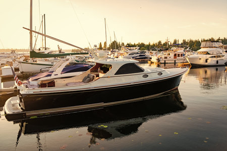 Summer boat vacation. Boat yachting. Yacht vacation in summer. Marina bay. A luxury motor yacht in...