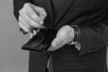 Man use stylus or pen on phone smartphone for signature.
