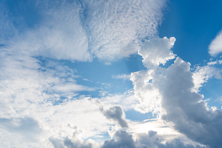 Blue Sky with Fluffy White Clouds on a Sunny Summer Day. Cloudscape - Blue sky and white clouds....
