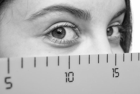 Math and mathematics. Education and knowledge. Girl student eye with ruler. Time to study. Knowledge of geometry. School education. Measuring mathematics tool. Teen girl back to schoolの写真素材