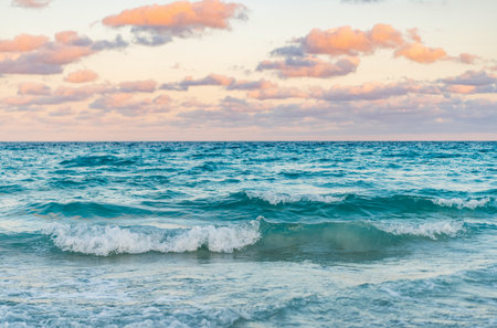 Sea sunset on ocean. Sunset seascape at summer vacation. Sunrise with sea beach. Dramatic sunrise horizon at sea. Romantic summer vacation on sunset seascapeの写真素材