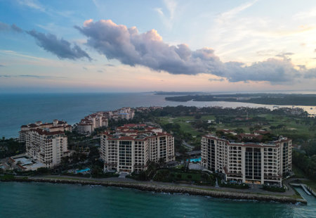 Fisher island sunset view. Sunset aerial view of Fisher island, Miami. Miami beach with waterfront architecture. Miami residential building, Florida. Fisher island. Travel destinationの写真素材