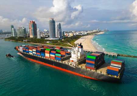 Cargo business. Port of Miami. Cargo ship with container in Miami, aerial view. Freight container on...