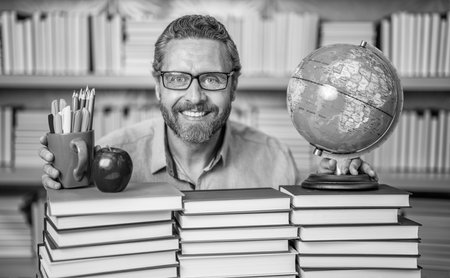 Knowledge and education concept. school teacher with book in classroom. teacher in classroom....