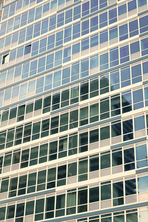 Glass building. Architectural detail. Background of architecture. Modern glass background. Glass...