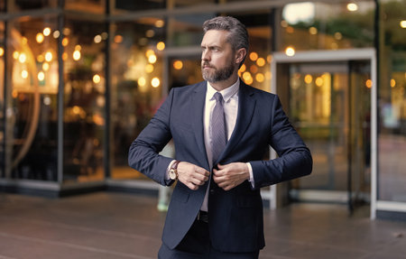 Businessman outdoor. Businessman in suit. Mature Hispanic businessman. Business boss portrait of business man. Successful business. Success of entrepreneur. Office managerの写真素材