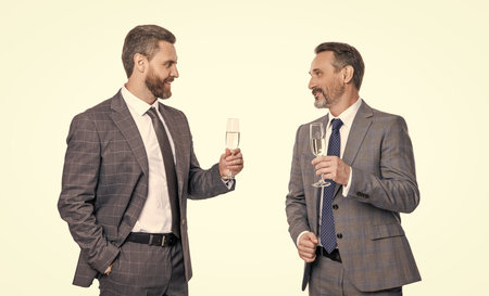 businessmen celebrating success after successful business dealing and partnership isolated on whiteの写真素材