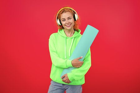 Woman in sportswear with fitness mat isolated on pink. Fit your body. Yoga and Pilates. Sport woman ready for workout. Healthy lifestyle. Fitness and sport. Yoga mat for training. Yoga practiceの写真素材