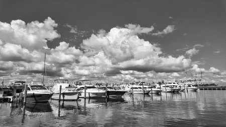 Yacht in navigation. Private luxury boat anchored off Miami beach. Summer boat vacation. Miami yachting. Yacht vacation in summer. Marina bay. A luxury motor yacht in sea marina bay. Luxury travelの写真素材