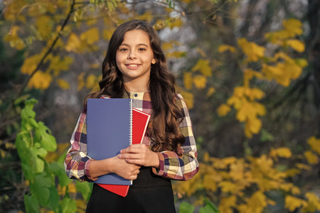 Back to school. Education and knowledge. School education. Student girl do homework in autumn....