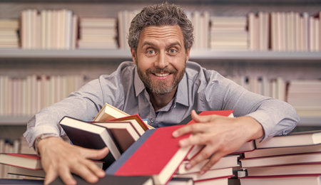 school education for teacher or student. school professor reading books in library. teacher of...