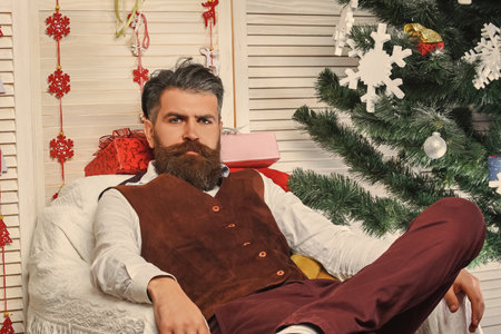 Happy New 2025 Year. Christmas party celebration. Xmas holiday in winter. Retro style. Man in retro suit at Christmas. Merry Christmas. New Year holiday. Bearded retro man on Xmasの写真素材