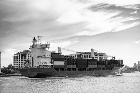 Cargo ship with container in Miami. Container on barge at Port Miami. Cargo ship barge at harbor...