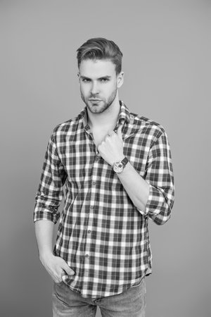 Man showing wristwatch. Time punctuality. Men in luxury wristwatch. Millennial handsome man showing wrist watch. Fashion accessory for men. Male fashion accessory. Man with hand watch. Model posingの写真素材