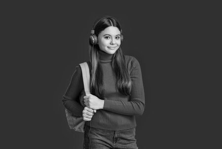 Knowledge through eLearning. Teen girl carry backpack. Back to school. Knowledge day. Concept of education. Teen girl student isolated on red. September 1. High school education. Virtual tutorialsの写真素材