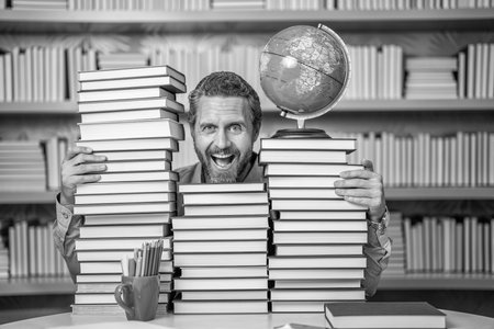 man nerd with school book. school literature education. nerd man in classroom. bookworm in school library. education and knowledge. man teacher in class. school education. Reading habitsの写真素材