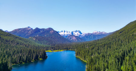 Cooper lake with mountain landscape. Landscape of mountain and forest of Cooper lake. Nature landscape. Cooper Lake in Washington. Scenic nature of popular hiking Cooper lake. Enchanting woodlandの写真素材