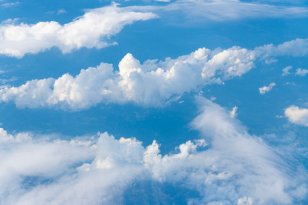 Blue Sky with Fluffy White Clouds on a Sunny Summer Day. Cloudscape - Blue sky and white clouds....