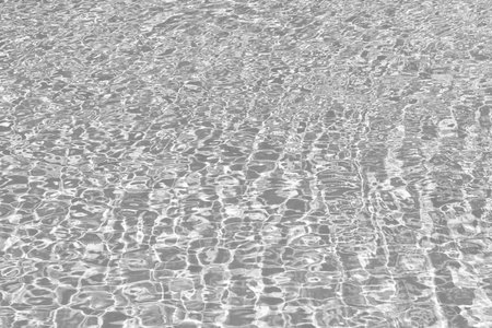 Pool side resort with pool water surface background. Sea ripples on blue pool background. Sea background. Swimming pool rippled. Summer vacation. Spa resort on summer vacation.の写真素材
