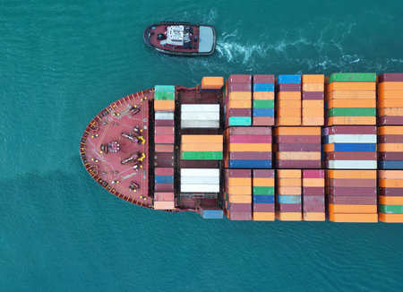 Cargo ship vessel leaving port. Container ship. Export and import. Cargo business. Shipping logistics. Cargo ship with container, aerial top view. Freight container on cargo vessel. Sea transportationの写真素材