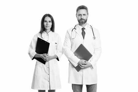 prescriber physician with nurse hold prescription clipboard with medical record isolated on white, medicine and healthcareの写真素材