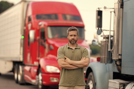 Trucking owner. Transportation vehicles. Hispanic man posing in front of truck. Semi trucks vehicle....