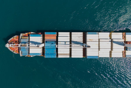 Cargo ship with container, aerial top view. Freight container on cargo vessel. Cargo ship vessel...