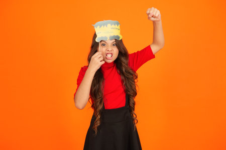 All Hallows party celebration. All Hallows props. Funny party props. Girl with Halloween party props. Happy Halloween. Spooky girl ready for Halloween party isolated on orange. Trick or treatの写真素材